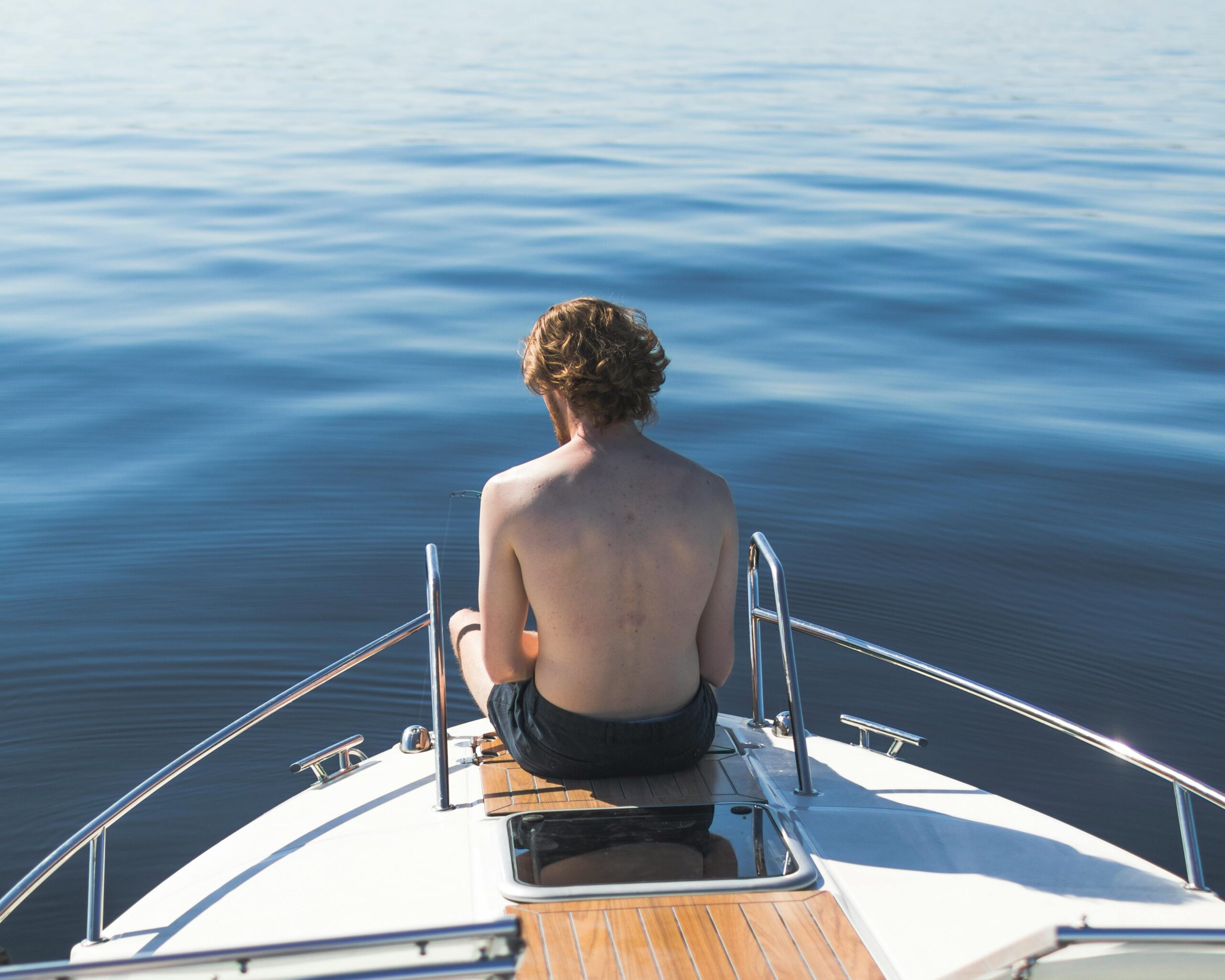 Shirtless guy on boat